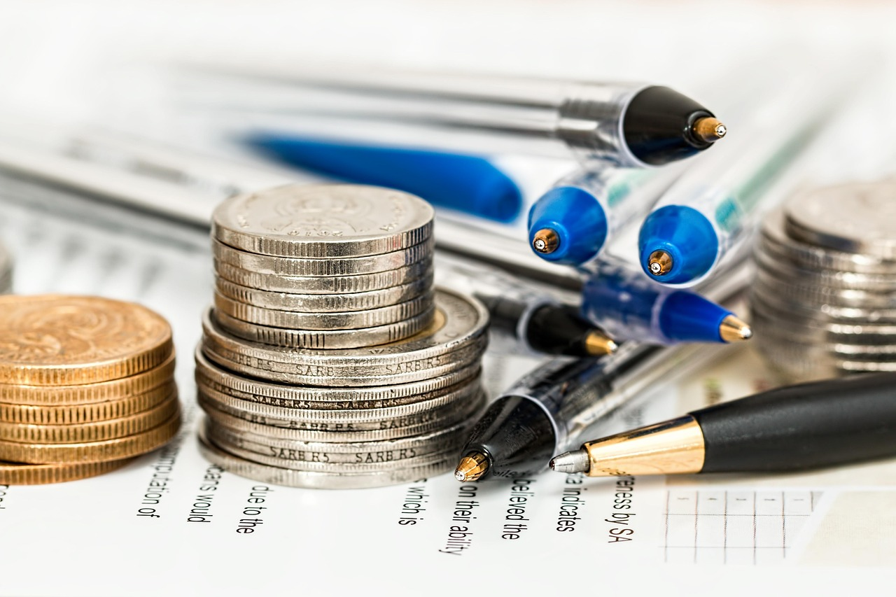 coins, pens and tabulating sheet