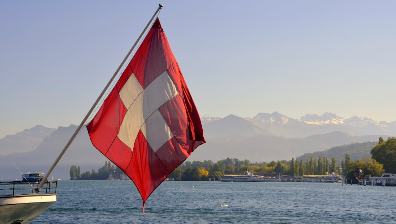 A flag of Switzerland on a pole
