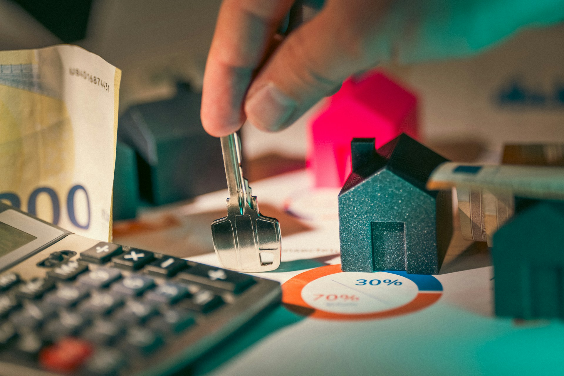 A key with a miniature house
