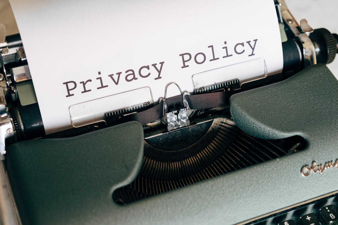 Typewriter showing a paper with the text privacy policy