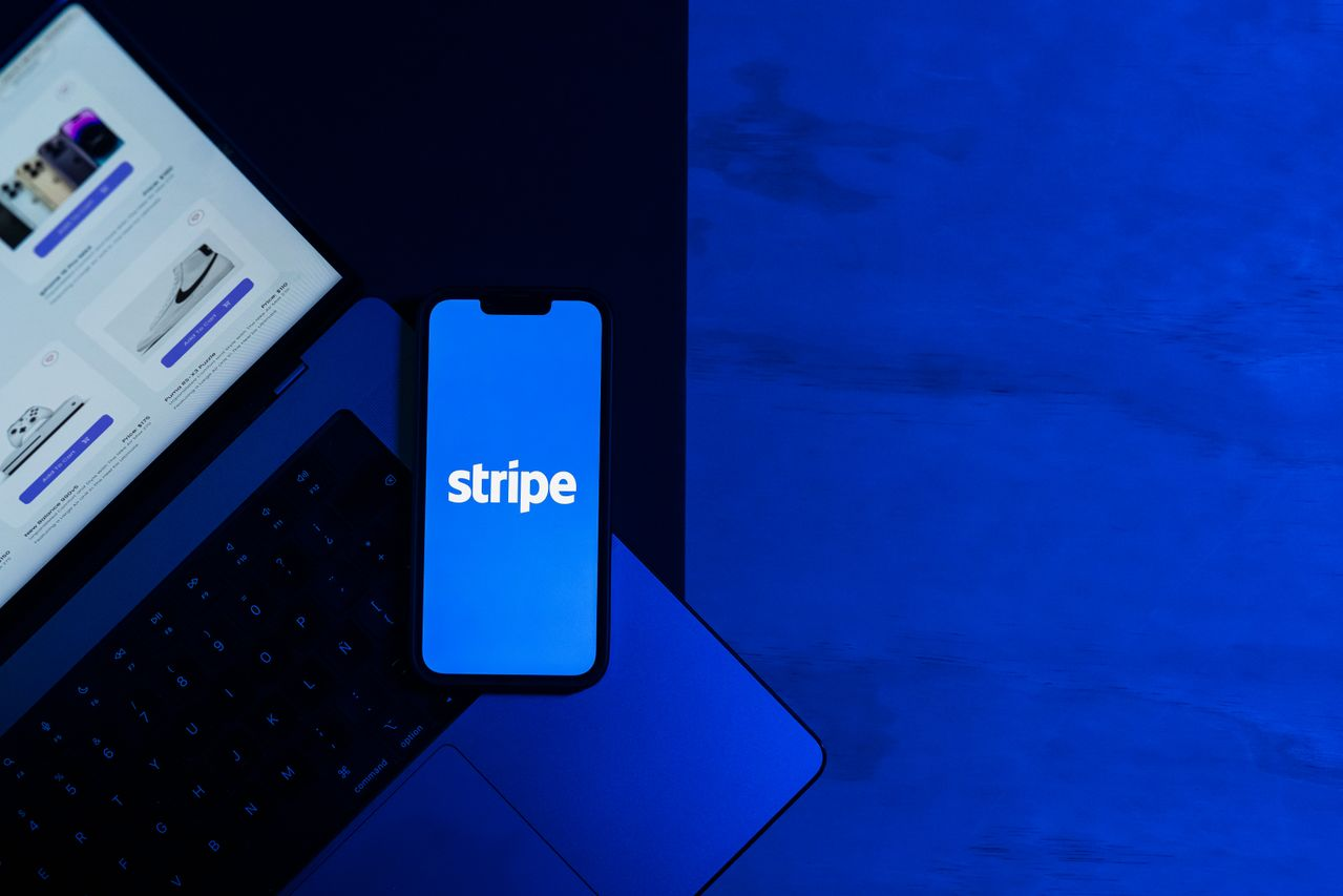 A smartphone displaying the Stripe app placed on a laptop keyboard