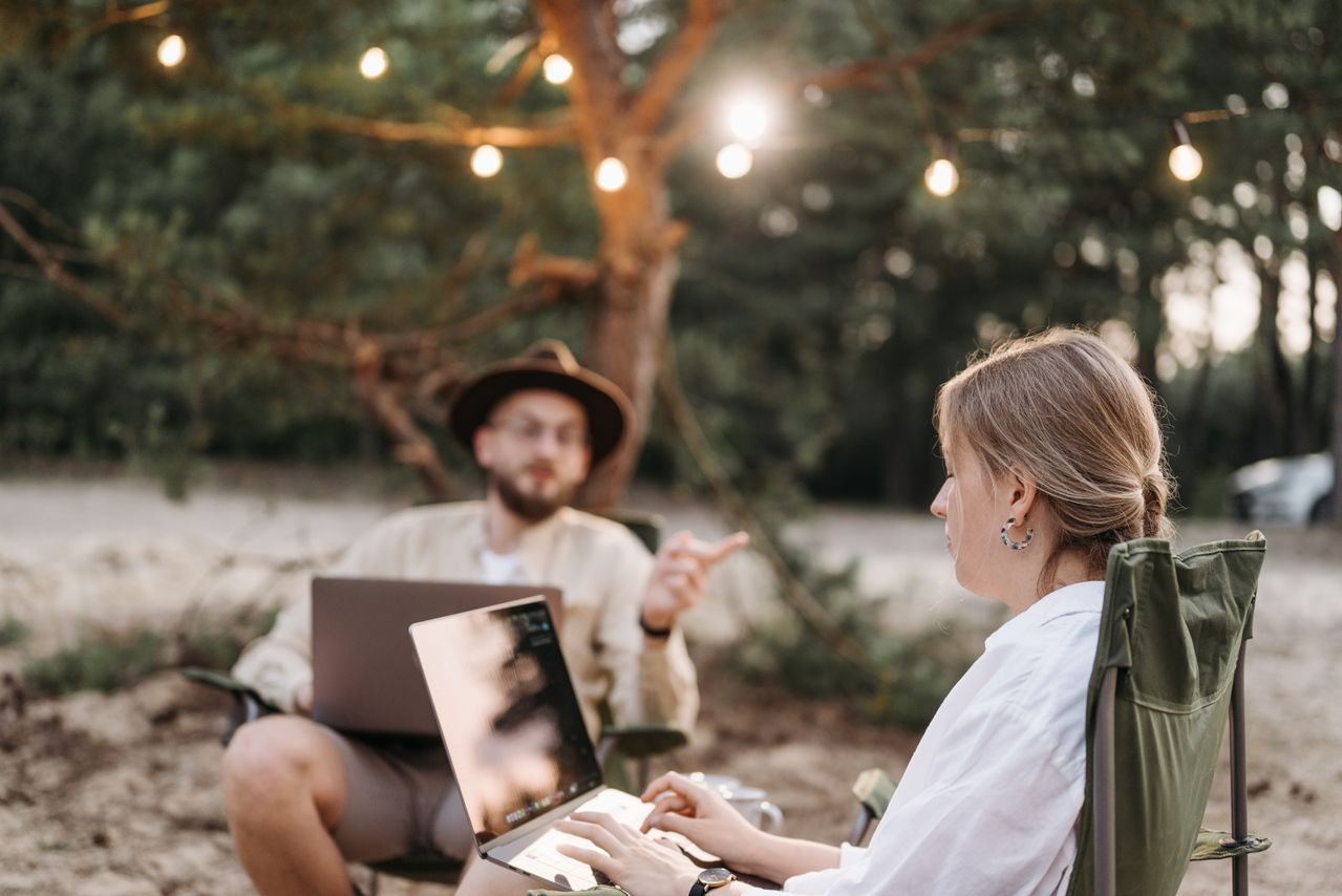 A couple of digital nomads working outside