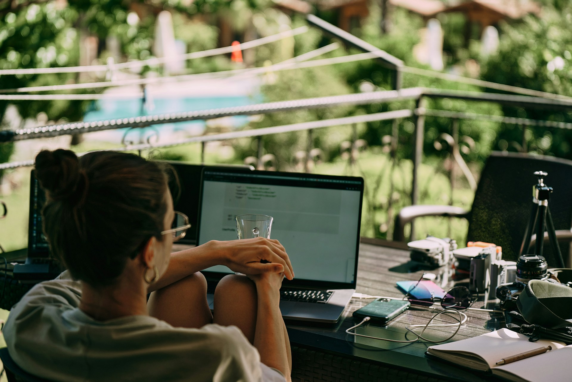 A girl working on the table on the terrace