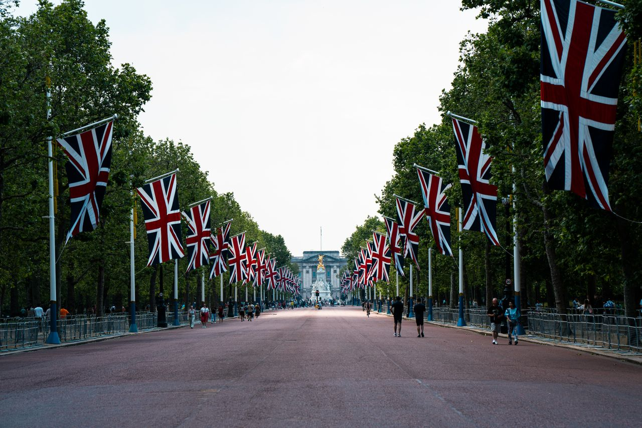 A landmark in London decorated with British flags