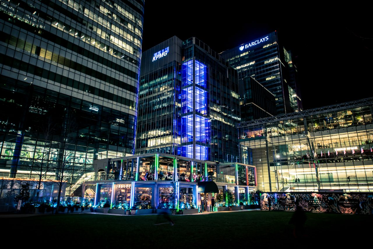 A night shot of a Barclays building
