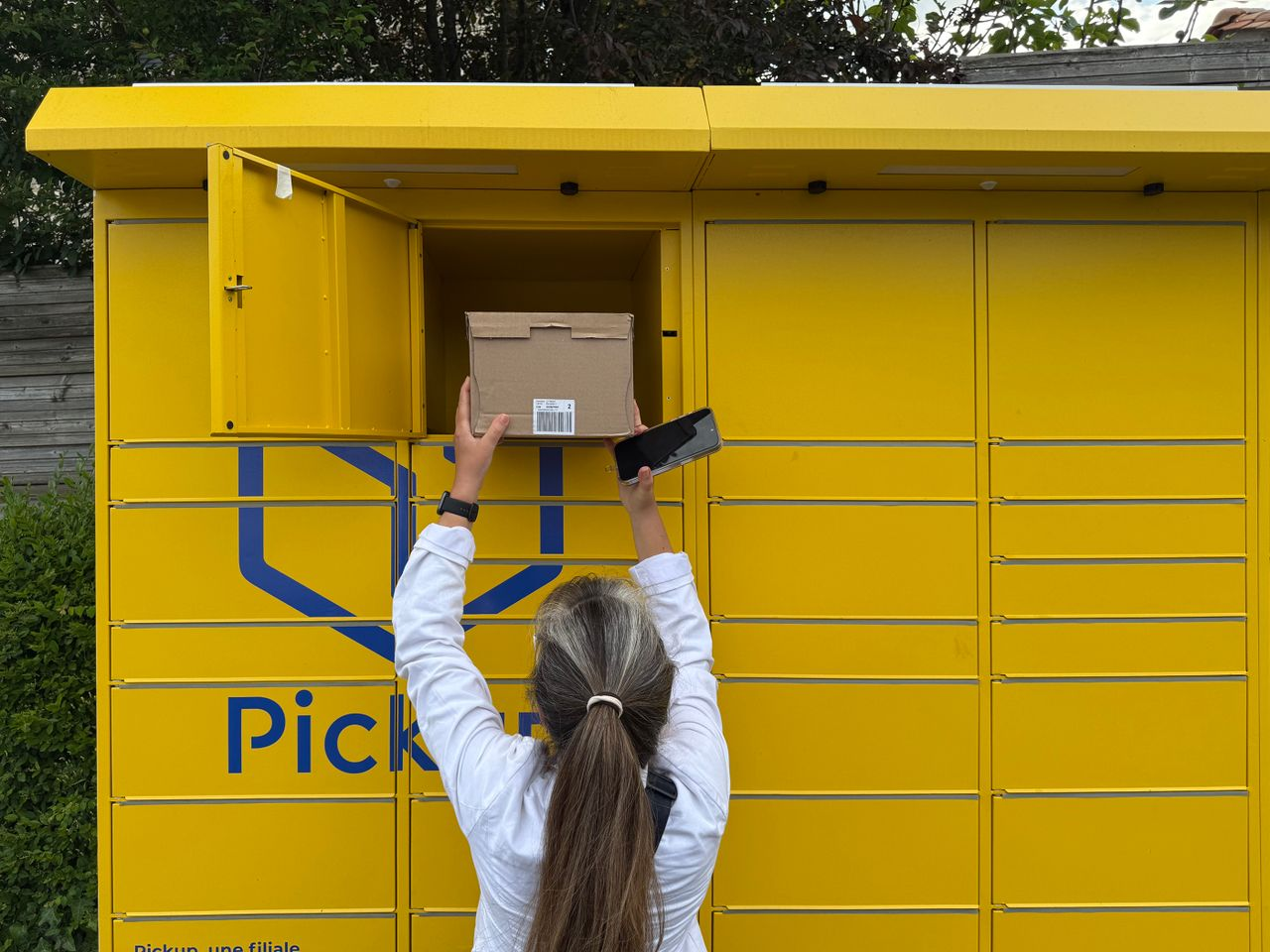 A woman placing a package