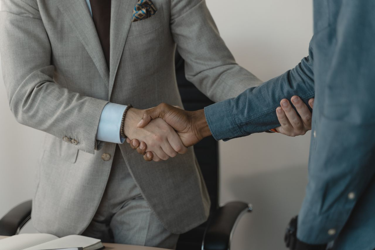 Close up of two people shaking hands