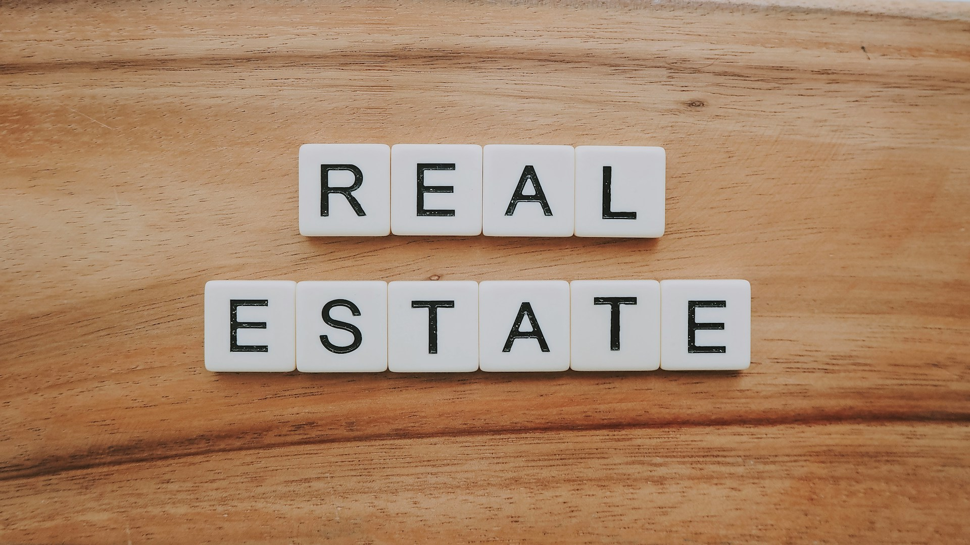 Letter blocks spelling out the word REAL ESTATE