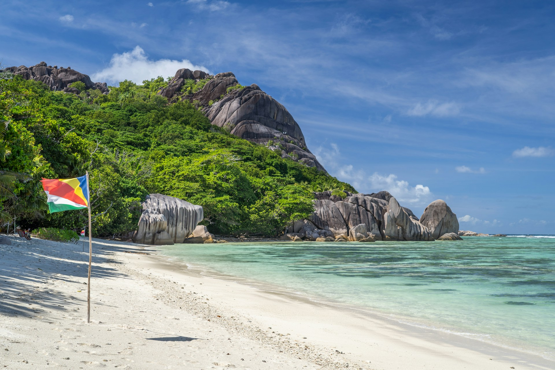 A beach in Seychelles with its flag