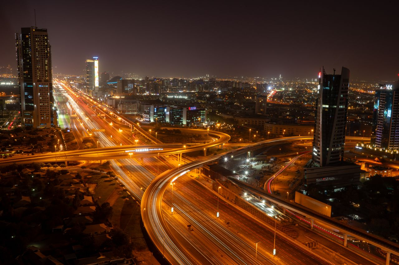 Dubai's vibrant skyline and illuminated roads at night