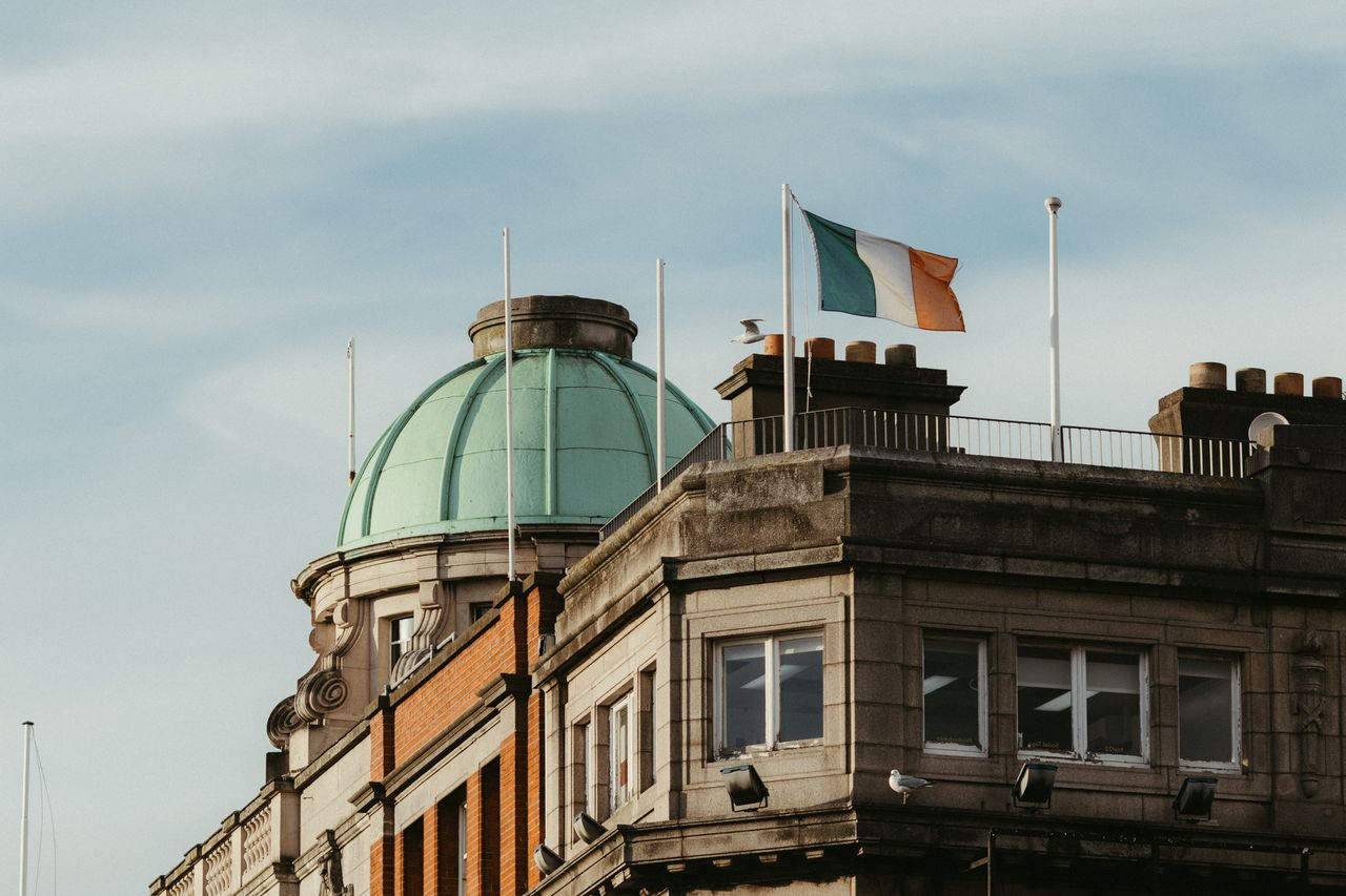 Historic Dublin architecture with the Irish flag