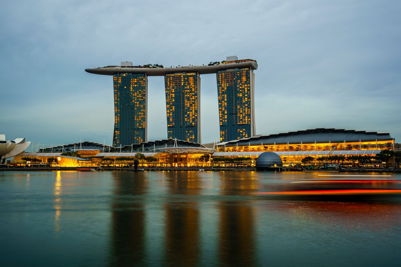 Marina Bay Sands illuminated at sunset in Singapore