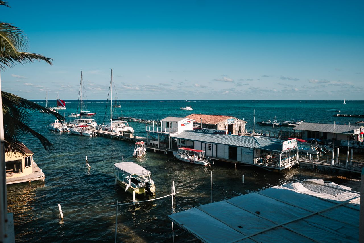 Marina with sailboats and clear blue waters in Belize
