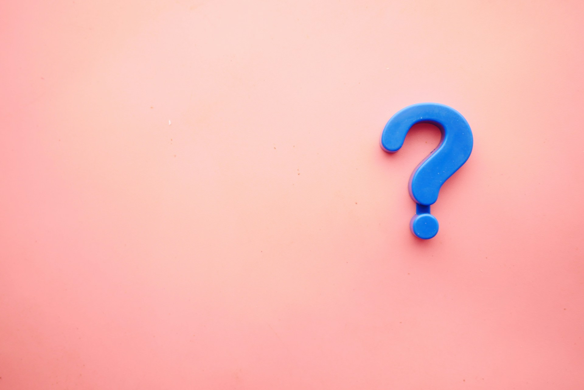 Question mark symbol on a pink background