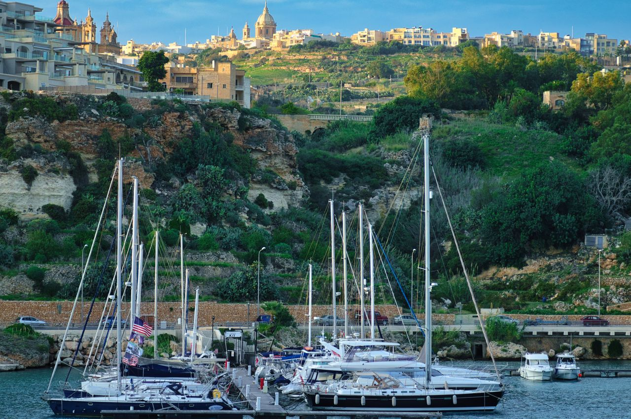 Yachts docked at a marina in Malta